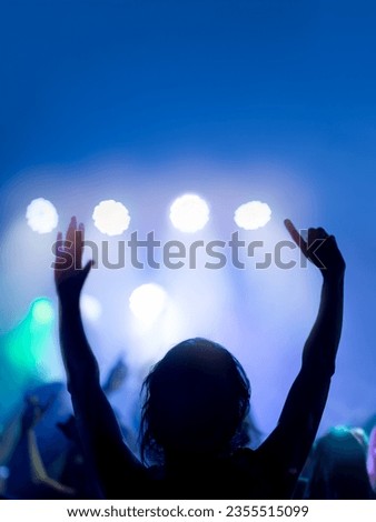 Hands up. Nightlife and disco concept. People dancing in club party. Selective Focus
