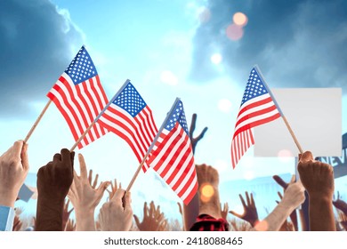 Hands with US flags at a demonstration or protest rally