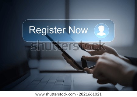 Hands use a tablet displaying a registration button, photographic style, dark laptop background, concept of digital signup access