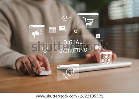 Hands using computer with digital marketing icons, representing online advertising, e-commerce, SEO, social media, targeting strategy, content creation and internet marketing for business growth.