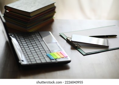 Hands using laptop and phone for online shopping, close up clean image in front of window in soft light - Shutterstock ID 2226043955