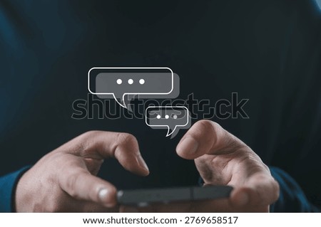 Hands using smartphone with chat bubble icons representing online messaging, digital communication, customer support, social media interaction and mobile conversation in modern internet technology.