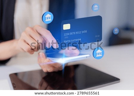 hands using smartphone with virtual credit card and banking icons holographic display for mobile payment and fintech