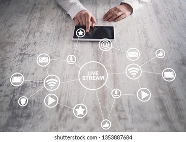 Hands using tablet.