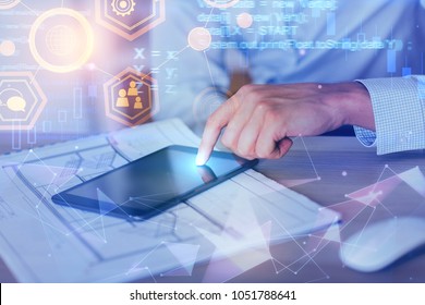 Hands using tablet on abstract background with glowing digtal interface. Future and device concept. Double exposure 