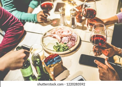 Hands View Of Friends Group Drinking Wine Inside Vintage Pub Restaurant - Young People Eating Appetizer Food And Having Fun Together - Youth And Dinner Concept - Focus On Right Bottom Hand Fingers