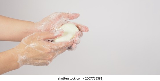 Hands Washing Gesture With Bar Soap And Bubble On White Background.