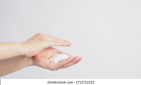 Hands Washing Gesture With Foaming Hand Soap On White Background.