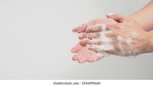 Hands Washing Gesture With Foaming Hand Soap On White Background.