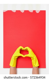 Hands Wearing Yellow Rubber Gloves Make Heart Shape Sign On Red Background