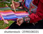 The hands of a weaver hold generations of skill, patience, and creativity, turning simple strands into works of art. Each weave is a journey, each knot a memory.  Chinchero Cusco Peru.