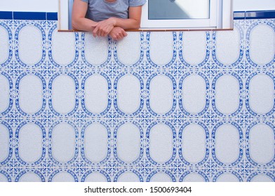 Hands in the window on backyard.