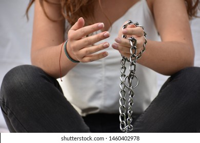 Hands From A Woman Breaking Chains