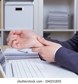 Hands Of Woman With Carpal Tunnel Syndrome Over Computer Keyboard