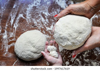 Hands Of A Woman And A Child Kneading Dough