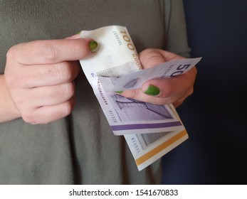 Hands Of A Woman Counting Danish Money