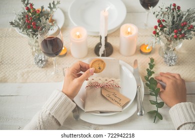 Hands Of Woman Eating Cookie After Christmas Dinner