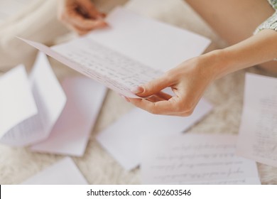 Hands Of A Woman Holding A Handwritten Note 