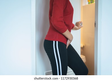 Hands Woman Holding Her Crotch,Female Need To Pee At Toilet