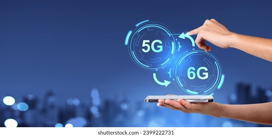 Hands of woman holding smartphone and interacting with 5G and 6G over blurry night city background. Concept of new generation of telecommunication - Powered by Shutterstock