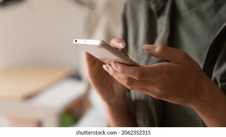 Hands of woman holding smartphone, using online app and virtual services cellphone, making video phone call, texting and chatting on messengers, buying online, reading books, articles. Close up - Powered by Shutterstock