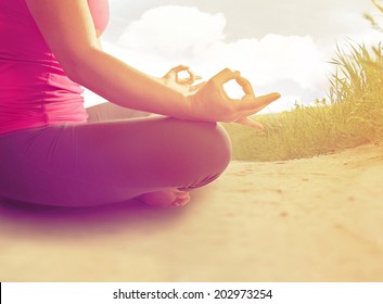  Hands Of A Woman Meditating In A Yoga Pose On The Beach Done With An Instagram Like Filter