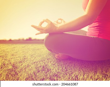  Hands Of A Woman Meditating In A Yoga Pose On The Grass Toned With A Soft Instagram Like Filter