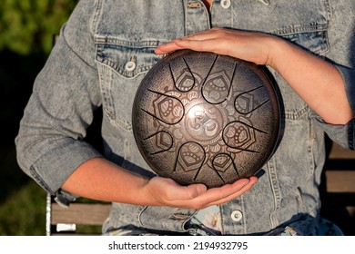 Hands Of Woman Musician Playing Steel Tongue Drum,music And Instrument.