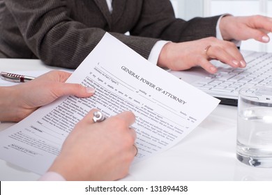 Hands of the woman signature document sitting on desk