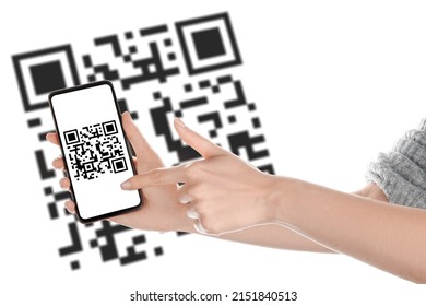 Hands of woman with smartphone scanning QR code on white background