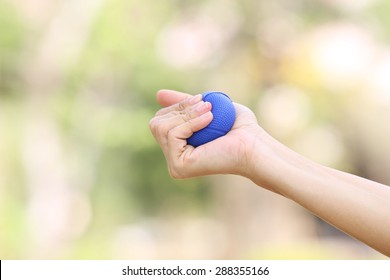 Hands Of A Woman Squeezing A Stress Ball