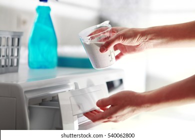 Hands Of Woman That Fills Detergent In The Washing Machine 