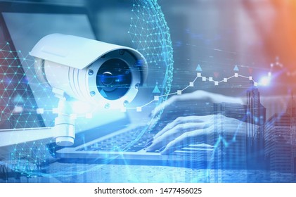 Hands of woman typing on laptop with double exposure of CCTV camera, planet interface and cityscape. Concept of surveillance and security. Toned image - Shutterstock ID 1477456025