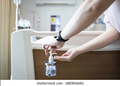 Hands Of Woman Using Hand Sanitizer Before Touching A Patient On The Bed At Hospital While Visiting,antiseptic Liquid For Hand Washing In Hospital Room,asian Girl Cleaning With Alcohol Antiseptic Gel