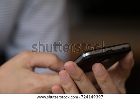 Hands of a woman using a mobile cell phone, shopping on line concept.