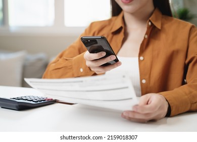 Hands Of Woman Using Mobile Smart Phone For Scan And Payment Bill Online