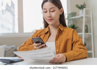 Hands Of Woman Using Mobile Smart Phone For Scan And Payment Bill Online