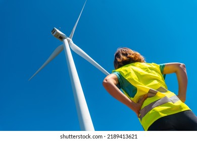 Hands Of A Woman Worker In A Wind Farm, Green Energy, Technical Review, Looking At The Turbine