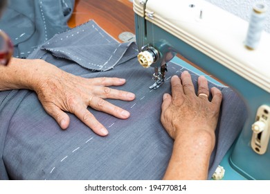 Hands Of A Woman Working In Sewing Machine / Woman Sewing