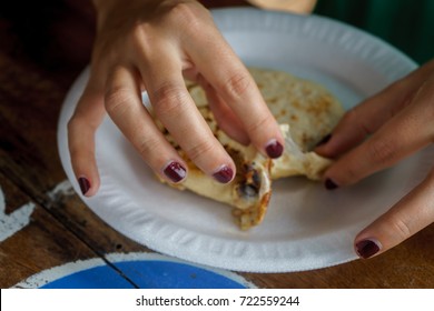 Hands Of Women Eating Pupusas, Typical Food Of El Salvador.