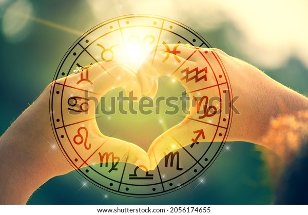 The\
hands of women and men are the heart shape with the sun light\
passing through the hands have astrological\
symbols