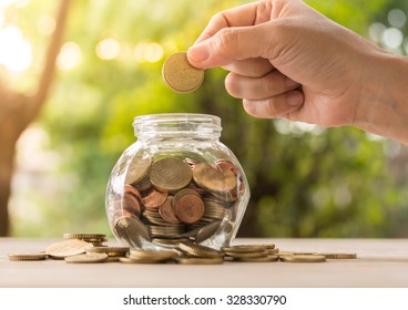 Woman Money Jar Stock Photos Images Photography Shutterstock - hand s women putting golden coins in money jar concept of banking finance and savings