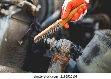 Hands Of Worker Repairing Car Parts In Auto Scrap. 