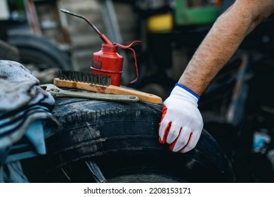 Hands Of Worker Repairing Car Parts In Auto Scrap.