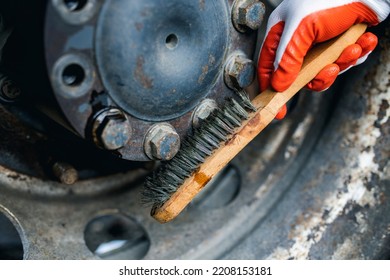 Hands Of Worker Repairing Car Parts In Auto Scrap.