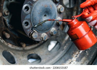 Hands Of Worker Repairing Car Parts In Auto Scrap.