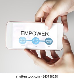 Hands working on digital device network graphic overlay