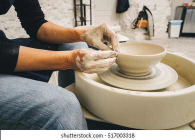 Hands Working On Pottery Wheel