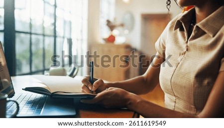 Hands, writing notes and remote work from home by laptop, planning or freelancer with project. Person, writer or editor with notebook, computer and journal for article, review or newsletter in house