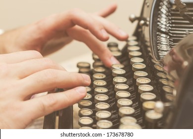 Hands writing on old typewriter - Powered by Shutterstock